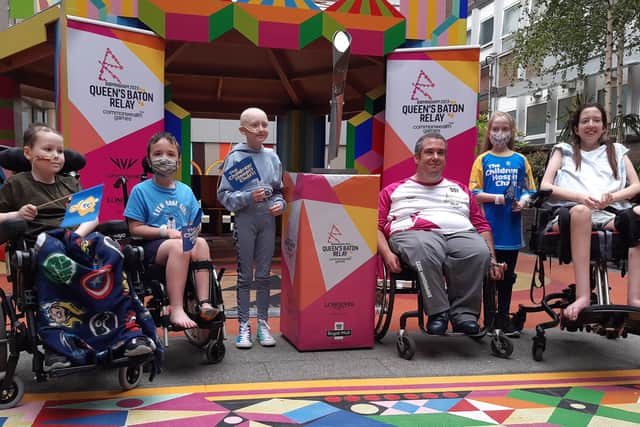 Eighteen years ago, Sheffield Children’s Hospital saved his life. And today, Fraser Lamb, now aged 30, made a triumphant return to the hospital, carrying the baton for the 2020 Birmingham Commonwealth Games’ baton relay. Fraser is pictured with patients and the baton in one of the hospital's gardens.