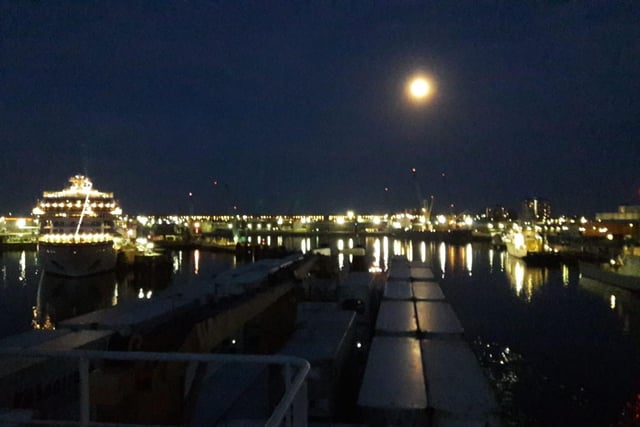 The April 7 supermoon as it was seen over Portsmouth International Port. Viking Sea is also berthed, left.