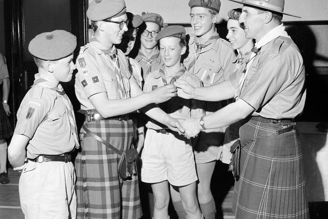 Iain McLean, of the 25th Edinburgh Troop, being presented with the Queen's Scout Award at Braid Church Hall, in Morningside, in October 1964.