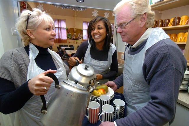 Anne Modiri and volunteers Nicola Pitt and Alan Haigh get ready for the Homeless and Rootless at Christmas Dinner at the Broomhall Centre,Sheffield, December 2010