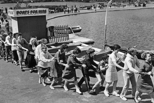 Staff of Woolworths store in South Shields conga their way round the South Marine Park lake for Sport Relief in 1986. Is there someone you know in this photo?