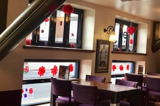 Diners are surrounded by beautiful handmade poppies
