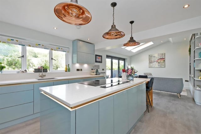 The stylish kitchen is a focal point of the family home
