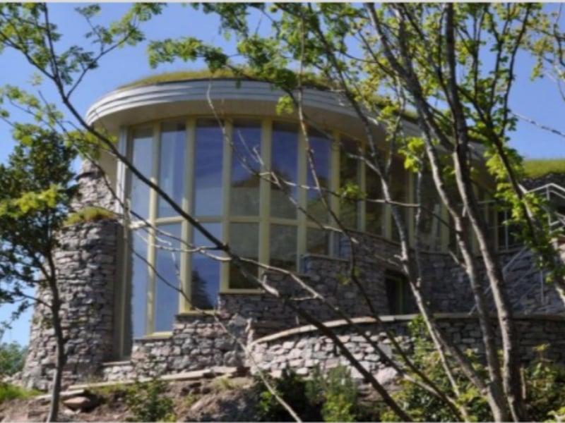 The cute cottages are set admist trees and verdant countryside.