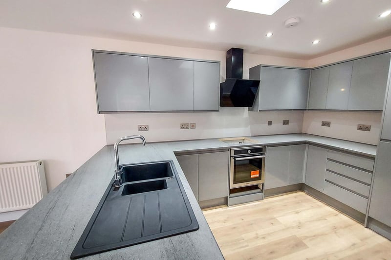 The kitchen combines a bright spacious interior and high quality fittings, says the Purplebricks brochure.