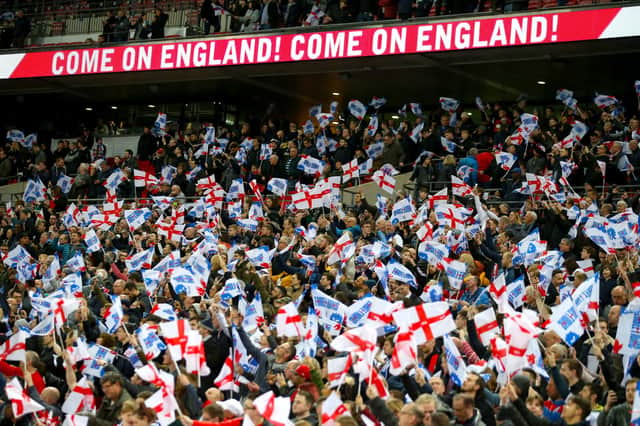 File photo dated 22-03-2019 of England fans in the stands at Wembley Stadium. Issue date: Monday July 5, 2021. PA Photo. Sports venues in England are set to return to full capacity from July 19 after the Government announced plans to ease the remaining restrictions on social distancing. See PA story SPORT Fans. Photo credit should read Steven Paston/PA Wire.