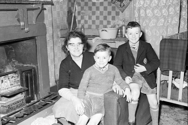 Bridget McGeever and her two sons were one of hundreds of families living in the traditional tenements of Leith Walk in February 1960. This picture was taken because they were being forced to evacuate the building due to a gas leak.
