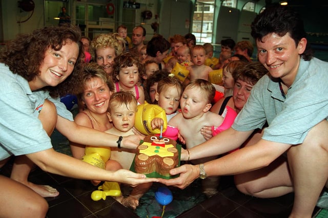 Swimming Instructors Anita Eyre and Lisa Wright pictured with some of the members of the Aqua Babies Group celebratuing their 1st Birthday at the Graves Tennis and Swimming Centre back in 1997