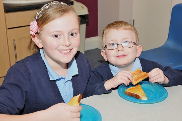 Owton Manor Primary School pupils Nicole Gray (11) and Curtis Morfoot (5) are pictured enjoying their toast at the school breakfast club which got the support of the Greggs Foundation in 2013.