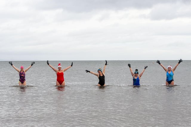 Elaine Mcohrie, Isabella McNamara, Kirsteen Barr-Kearsey, Marie Rudd and Jo Mellish from Wild Swim Scotland proudly posing after making it into Porty's waters despite the freezing weather.