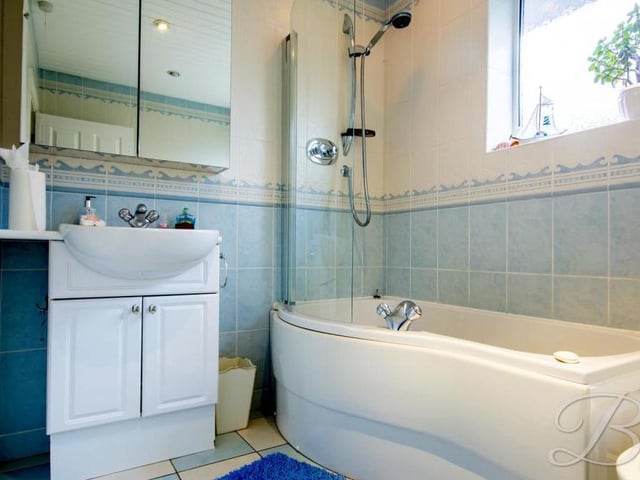 The main bathroom in the bungalow is a bonny asset. As well as bath with screen and overhead shower, it has a low-flush WC, wash hand basin and bidet.