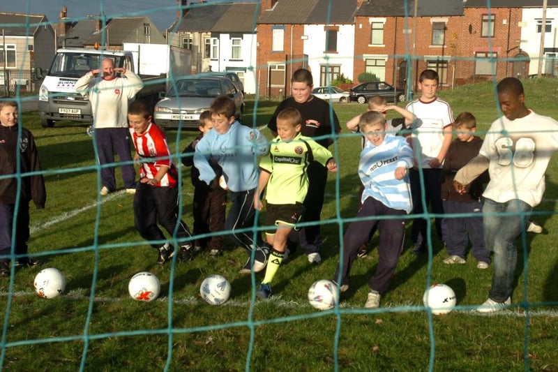Children taking part in a penalty shoot-out at Anns Grove School playing fields, Spencer Road, Sheffield. Heeley Development Trust, in conjunction with S Y Police, One Community One Game,  FURD, Heeley Boys Football Teams, Recycle and children from the area, organised an October 2007 half term event of fun and games
