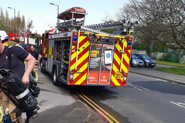 Two people had to be cut out of their vehicles after a crash which closed a road near Sheffield for nearly five hours. File picture shows South Yorkshire firefightes at a previous incident in Sheffield