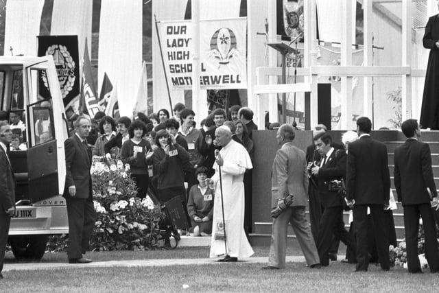 Pope John Paul II steps up to the microphone to address the crowd at Murrayfield stadium in Edinburgh during the Papal visit to Scotland in May 1982. 
