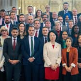 Members of Parliament gather with Yuan Yang (centre left) and Abtisam Mohamed (centre right) in Westminster Hall in the Houses of Parliament, London, to show support for the two Labour MPs who were denied entry to Israel are on their way home to the UK. Stefan Rousseau/PA Wire