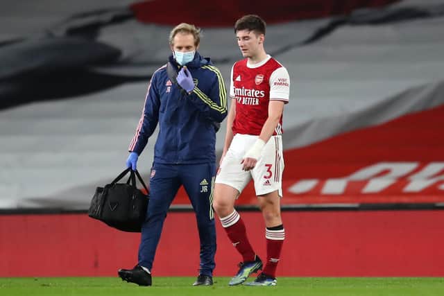 Arsenal's Kieran Tierney walks off the pitch with an injury against Liverpool: Catherine Ivill/PA Wire.