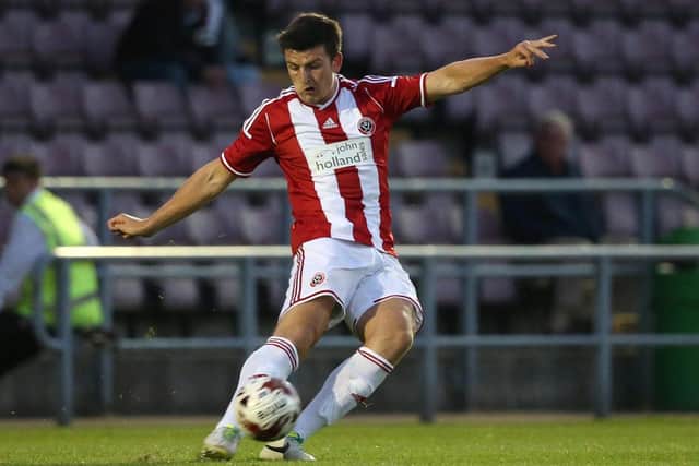 Harry Maguire in action for Sheffield United