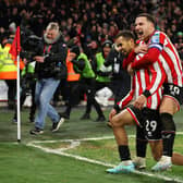 SHEFFIELD, ENGLAND - MARCH 01: Iliman Ndiaye of Sheffield United celebrates with teammate Billy Sharp after scoring the team's first goal during the Emirates FA Cup Fifth Round match between Sheffield United and Tottenham Hotspur at Bramall Lane on March 01, 2023 in Sheffield, England. (Photo by Catherine Ivill/Getty Images)