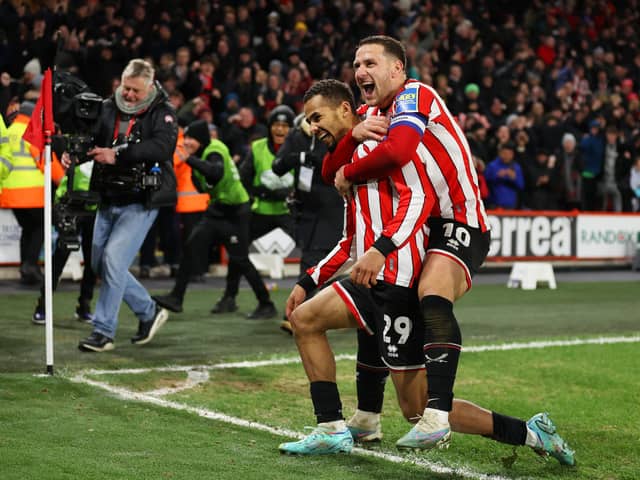 SHEFFIELD, ENGLAND - MARCH 01: Iliman Ndiaye of Sheffield United celebrates with teammate Billy Sharp after scoring the team's first goal during the Emirates FA Cup Fifth Round match between Sheffield United and Tottenham Hotspur at Bramall Lane on March 01, 2023 in Sheffield, England. (Photo by Catherine Ivill/Getty Images)