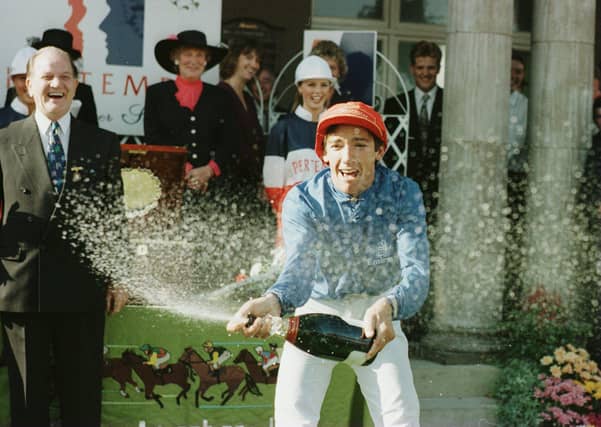 Frankie Dettori celebrates victory on Classic Cliche in the 1995 race.