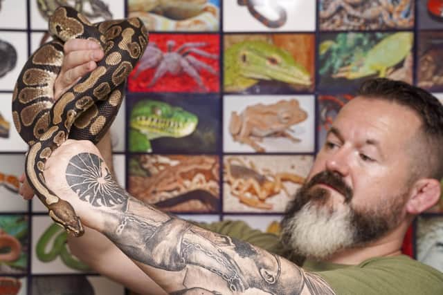Concerns have been raised after snakes usually found in Africa were found in a popular Sheffield park. Charles Thompsonis pictured with a royal python that was dumped in. Graves Park. Picture Scott Merrylees