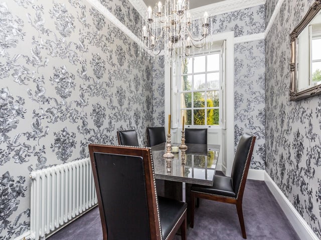 Having a window to the rear, original shutters, ornate ceiling coving and skirting.