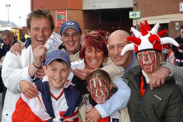 United fans are in high spirits outside Old Trafford before their side's FA Cup semi-final with Arsenal in April 2003. The Gunners won 1-0.