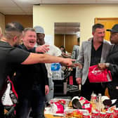 Boxing greats Frank Bruno, Nigel Benn, Joe Calzaghe and Ricky Hatton sample food from 'Britain's best' takeaway Munchies, on London Road, Sheffield, during a show in the city