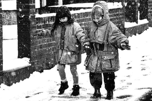 Two youngsters take it easy down Erskine Road in this February 1994 photo.