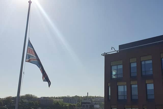 A flag flying at half-mast in honour of a police officer killed in a crash in Sheffield yesterday