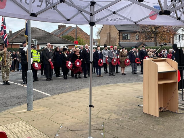 Community figures and veterans lined up at the war memorial in Eastwood.