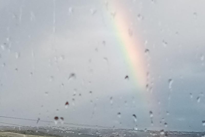 Rachel Stevenson sent in this lovely picture of a rain speckled window, complete with a rainbow outside.