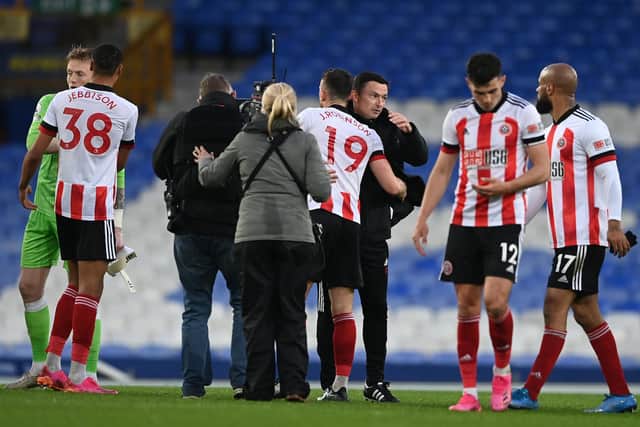 LIVERPOOL, ENGLAND - MAY 16: Paul Heckingbottom, Manager of Sheffield United celebrates victory with Jack Robinson of Sheffield United following the Premier League match between Everton and Sheffield United at Goodison Park on May 16, 2021 in Liverpool, England: Gareth Copley/Getty Images