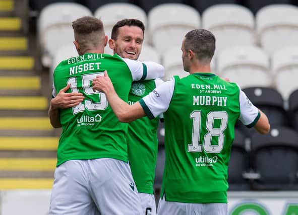 Kevin Nisbet and Jamie Murphy celebrate with Paul McGinn after the latter laid on the opening goal for the former. Picture: SNS