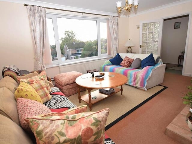 Another glance at the lounge from a different angle. It is so comfortable, thanks largely to a fireplace with tiled surround and hearth.