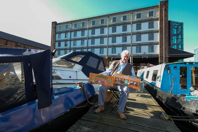 Artist Joe Scarborough working on his latest projects on his boat in Sheffield Canal Basin.