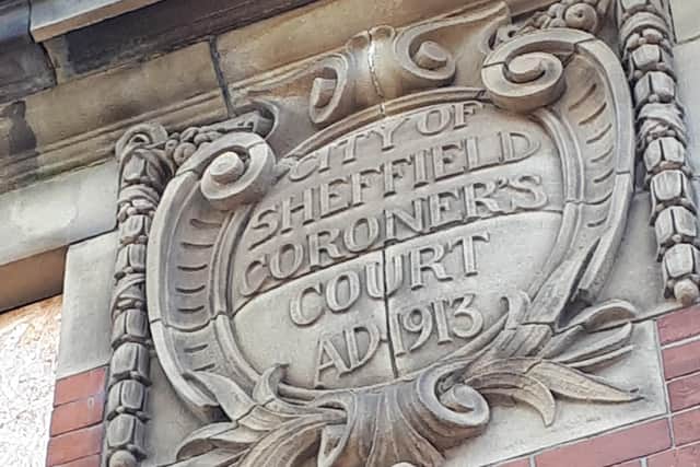 The cartouche above the main door of the Old Coroner's Court