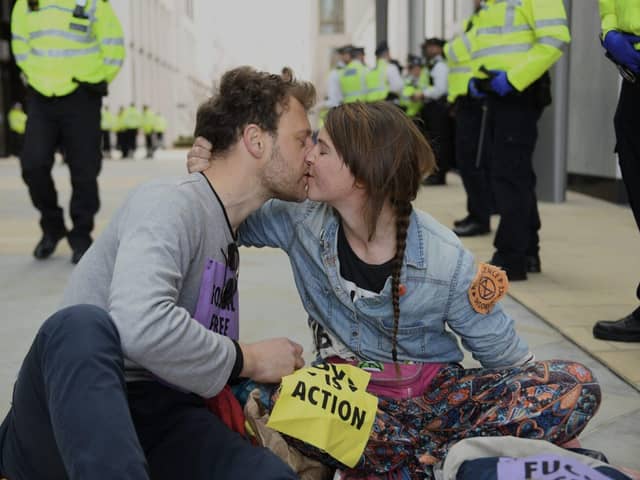 Michael and Addie protesting outside Shell, London