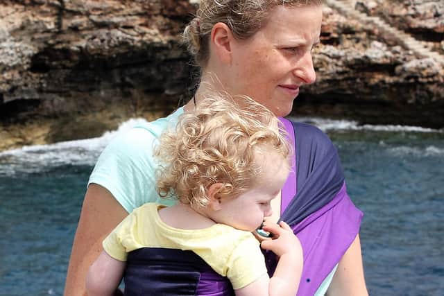 Alex carrying Georgina in a Purple and Navy Pouch Sling when she was 18 months-old.