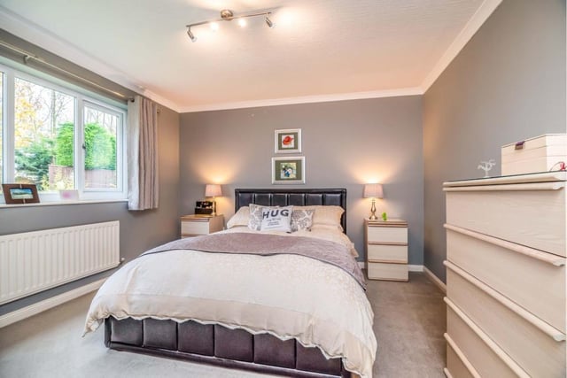 The master bedroom boasts an en-suite and a walk-in wardrobe.