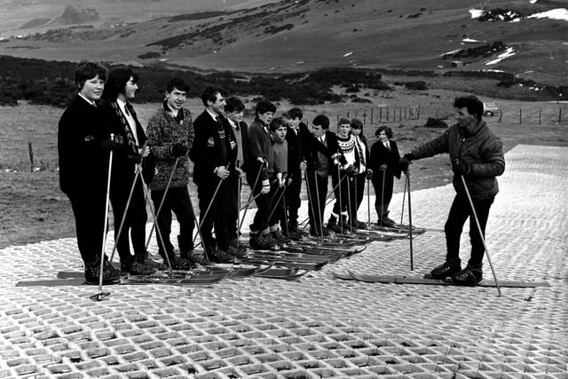 Children from an unknown school on Hillend artificial ski slope in December 1965.