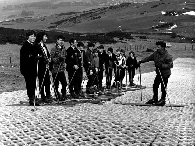 Children from an unknown school on Hillend artificial ski slope in December 1965.