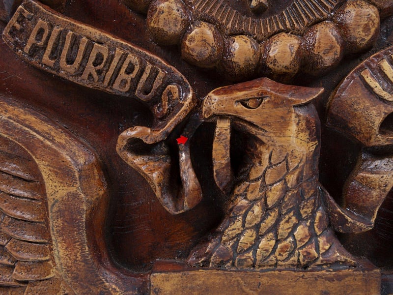 A wooden reproduction of the carved American Great Seal plaque which was gifted to the American ambassador to Russia in 1945 by the Soviet Boy Scouts, and which contained a hidden microphone listening device or "bug." The discovery was kept secret for years by the US until tensions between the two superpowers exploded in the media after an American U2 spy plane was shot down over Russia in 1960. As a rebuttal to Russian claims that the US was spying on them the plaque and it's hidden microphone (aka The Thing) was revealed during corresponding court proceedings.