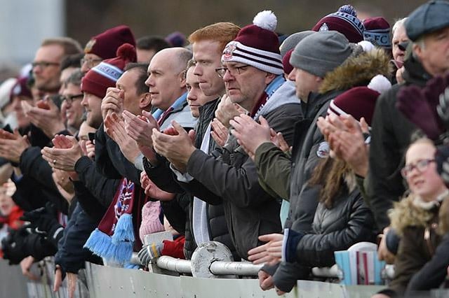 Supporters give their backing during the game.