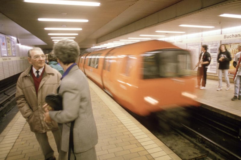 A couple chatting in Buchanan Street station as the train comes in, August 1990. There have been some changes to Buchanan Street since then with the most noticeable being the glass divider between the platforms. 
