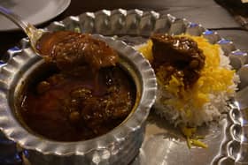 Khoreshite Gheymeh Bademjan , a lamb dish served with saffron-infused rice