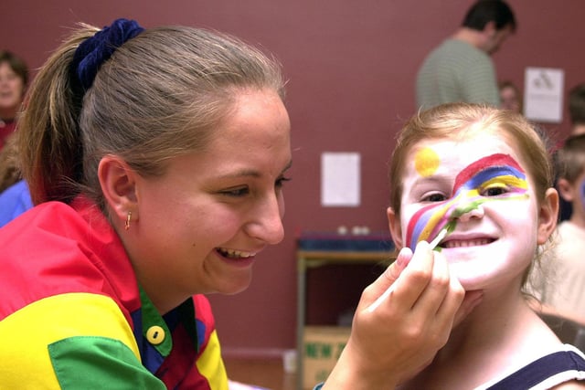 Joanne Varndell, aged 20, of Bircotes, painted six year-old Amy Moss's face at the Rossington Hall School summer fayre held in 2000