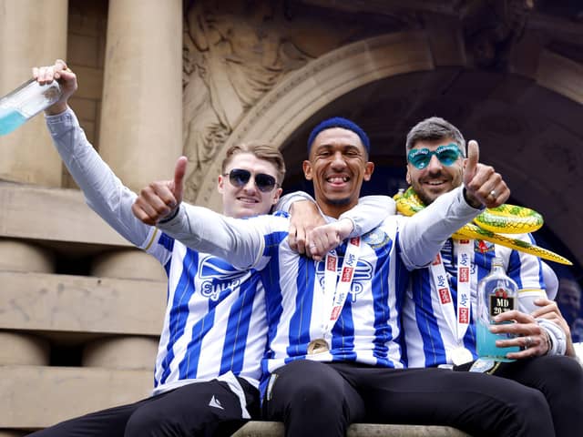 Sheffield Wednesday's George Byers, Liam Palmer and Callum Paterson celebrate their promotion to the Sky Bet Championship at Sheffield Town Hall following an open top bus parade. Sheffield Wednesday secured their promotion to the Championship after Josh Windass scored in injury time at the end of extra-time of the play-off final. Picture date: Wednesday May 31, 2023. PA Photo. See PA story SOCCER Sheff Wed. Photo credit should read: Richard Sellers/PA Wire.RESTRICTIONS: Use subject to restrictions. Editorial use only, no commercial use without prior consent from rights holder.