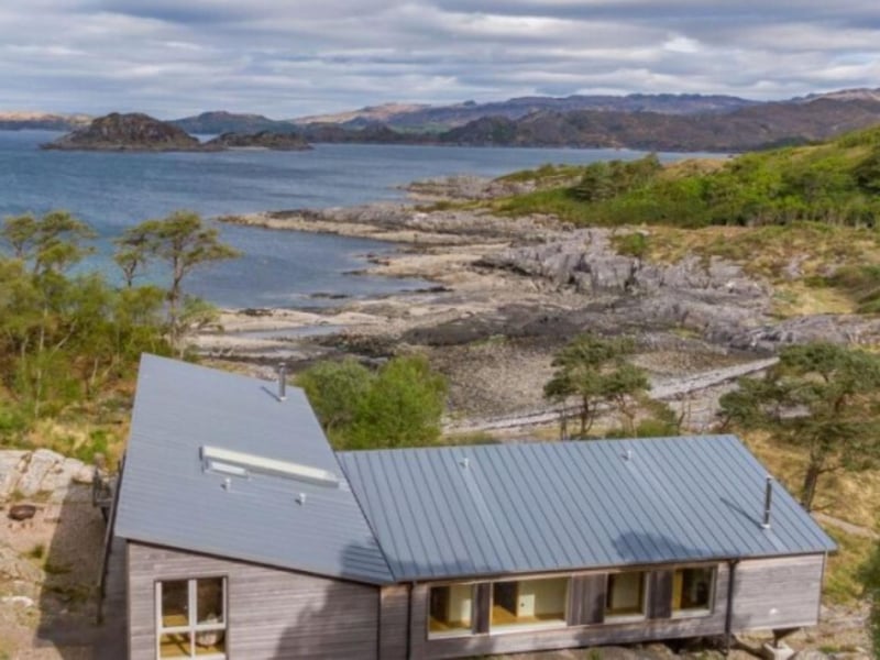 The holiday home enjoys panoramic coastal views.