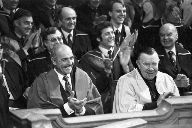 The men receive their honorary degree from Heriot-Watt university in November 1981.